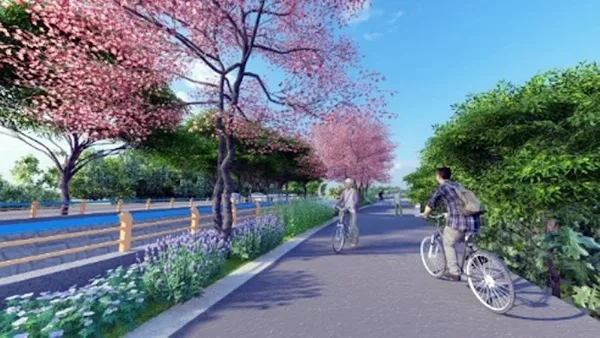 ▲彰化縣政府推動二水鄉復興村八堡一圳水岸廊道建置工程今日舉行開工典禮，預計114年9月完工，屆時民眾可騎車欣賞八堡一圳旁的花旗木，提升觀光與休憩品質，建構舒適的運動休憩環境。（模擬圖／彰化縣政府提供）