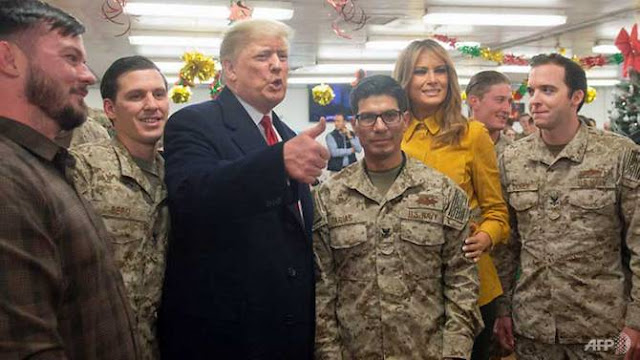 Donald trump with American military forces in IRAQ.