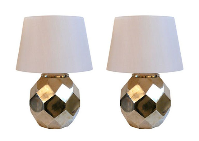 two ceramic lamps with white shades with brass finish