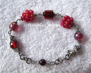 Wire wrapped cherries Bracelet with herringbone weave bead