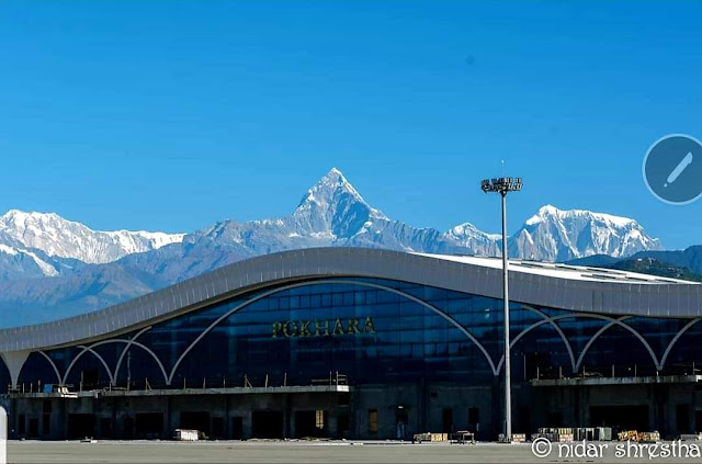 Pokhara International airport main terminal and Mount Machhapuchhre on back drop