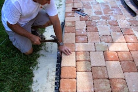 securing the edging for the patio stone pavers project 