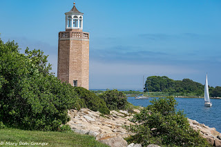 Avery Point Lighthouse and Sailboat photo by mbgphoto