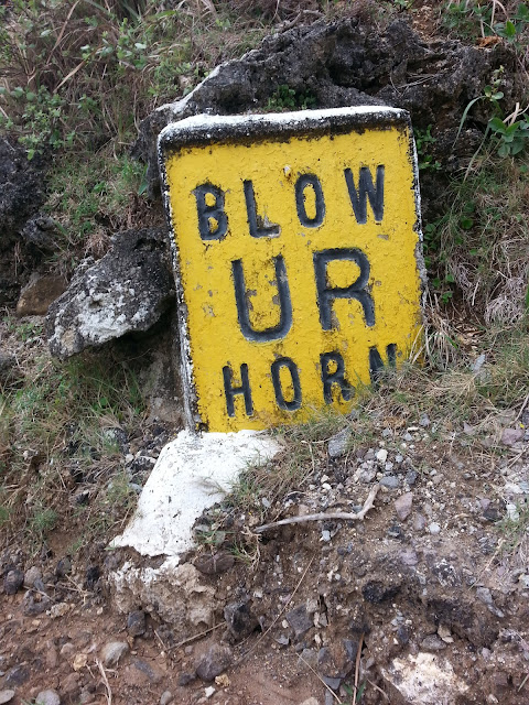 BLOW UR HORN is painted and engraved on a stone marker