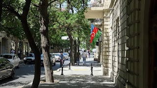 A flag hangs at a wall on a House in Baku