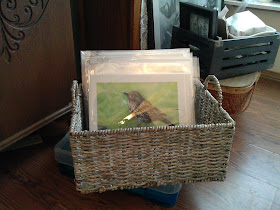 My Giclee art prints packaged and displayed in a rustic basket.