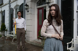 Mia Wasikowska as India, Matthew Goode as Charles, Charles stalk India, yellow umbrella, in Stoker (2013), Directed by Chan-wook Park