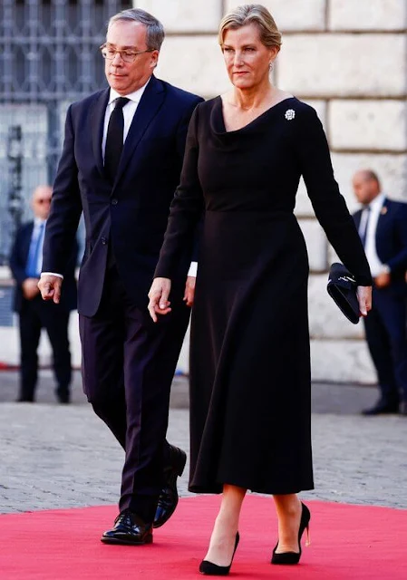 Duchess of Edinburgh wore a black midi dress. The Duchess is wearing her rose diamond brooch
