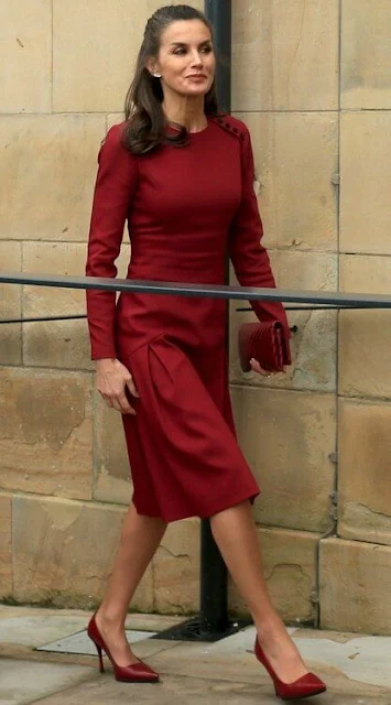 Queen Letizia wore a black wool and cashmere blend coat, and a new red midi dress by Carolina Herrera. The Prince of Wales