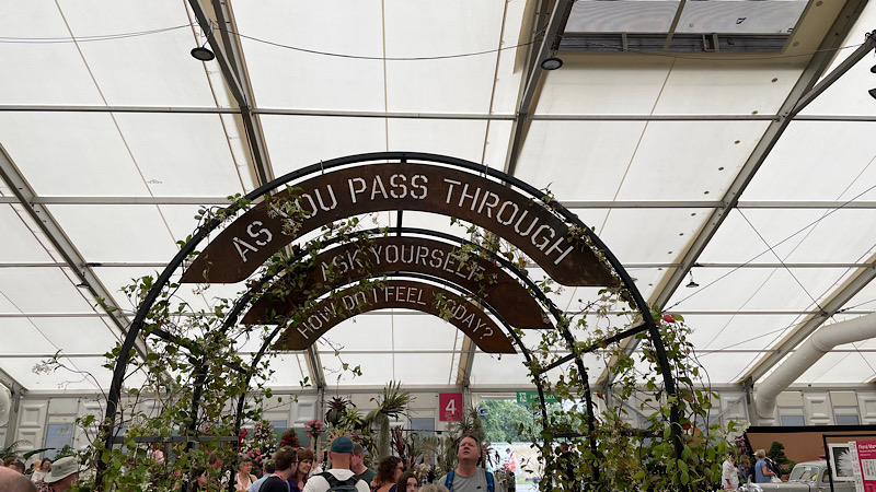 Arches stating: as you pass through, ask yourself, how do you feel today? | Hampton Court Garden Festival 2023