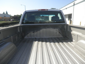 Rust inside salvaged bed before auto body repairs & paint at Almost Everything Auto Body