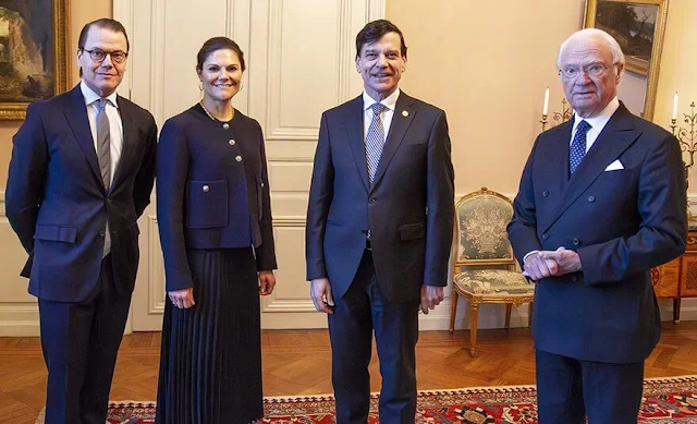 Crown Princess Victoria wore a navy blue cropped jacket by Massimo Dutti, and wore a navy blue pleated midi skirt by H&M