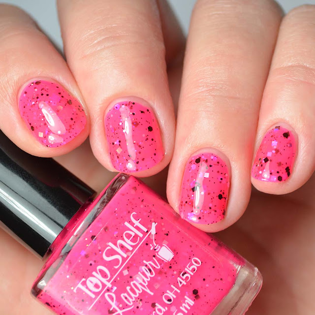 hot pink nail polish with black and iridescent glitter four finger swatch