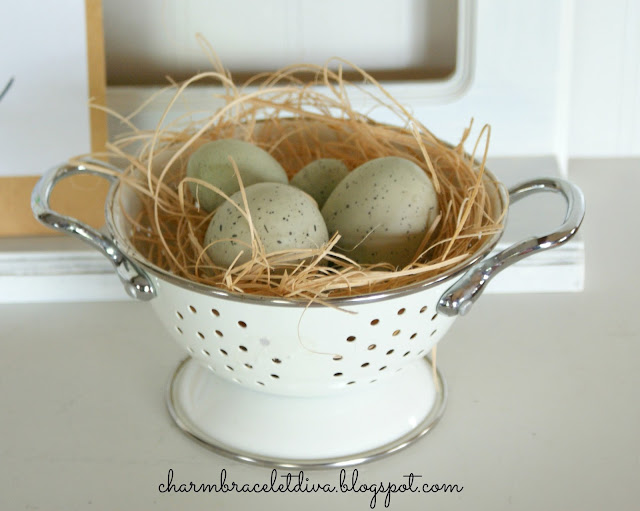 enamelware colander used as bird egg nest