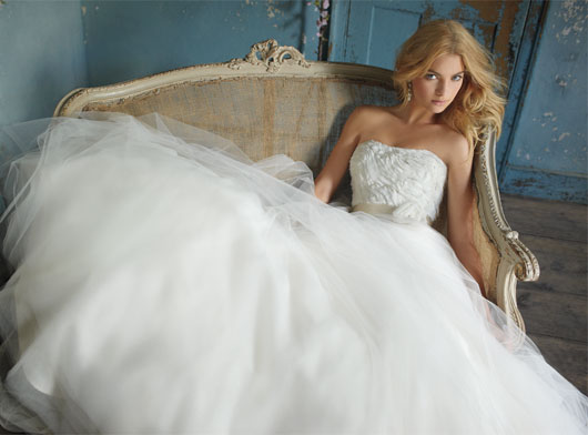 Above Diamond white tulle bridal ball gown with natural waist and full