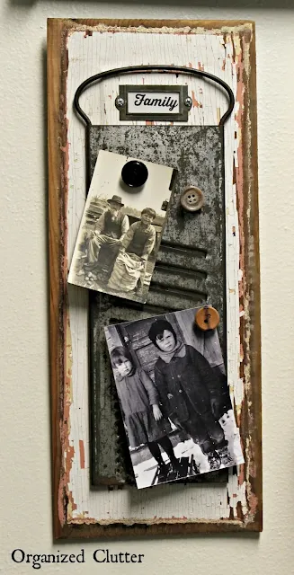 Photo of hot glued button magnets to hold old photos.