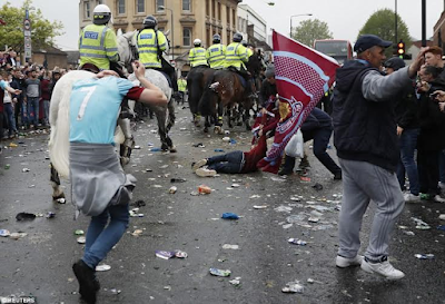 police on horses try to calm things in attack of man united bus by west ham fans