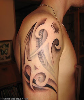 biomechanical upper arm tribal tattoo