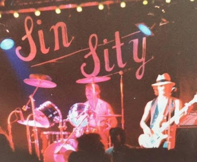 Sin Sity... Mike Edie (Lead vocals/Guitars)  Bob Sartori (Drums)  Jim Sartori (Bass)  Bill Burke (Guitars)  Tim Comella (Guitars)