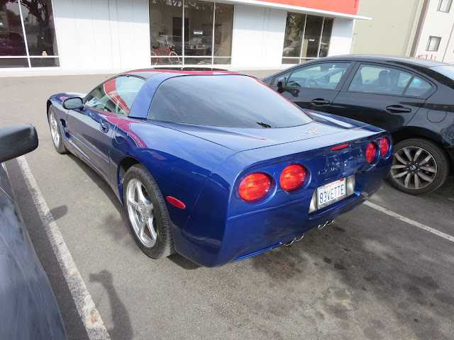 Corvette bumper and quarter panel after repairs at Almost Everything Auto Body.