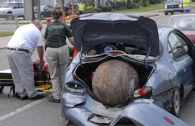 Runaway ball wrecks car