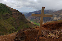 Cross overlooking canyon at Waimea Canyon State Park in Hawaii