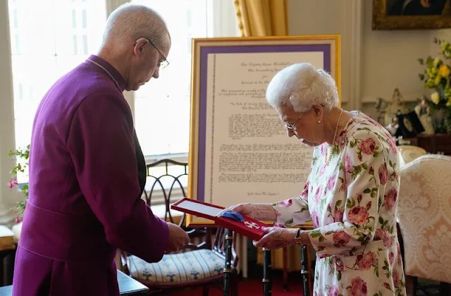 Queen Elizabeth wore a floral print silk dress. The Queen met Archbishop of Canterbury Justin Welby at Windsor Castle