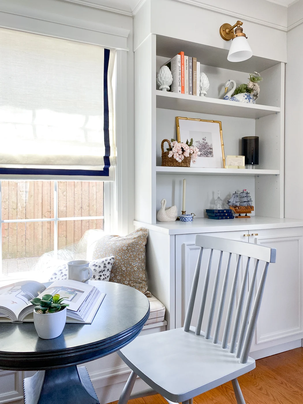 long room layout with built-in bookcases and extra seating