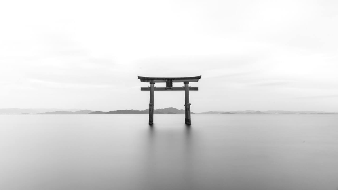 monochrome photo of chinese door alone in river | Monochromatic Photography In Black And White