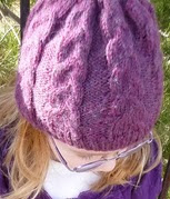 http://www.ravelry.com/patterns/library/kinleys-braided-cable-hat