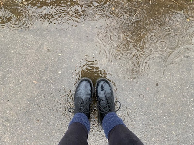 Boots standing in a puddle