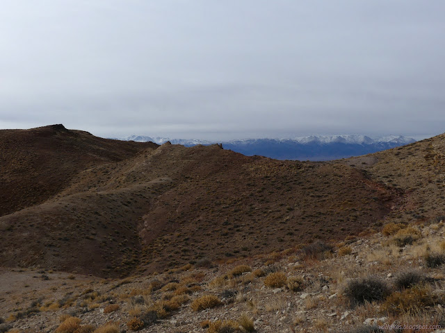 30: snow peaks over red ridge