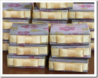 stacks of stamp club candle boxes