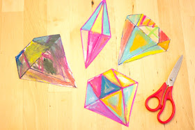 "Painting" with oil pastels to create beautiful "crystal" sun catchers with kids