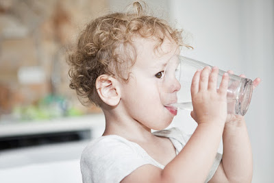 A baby drinking water