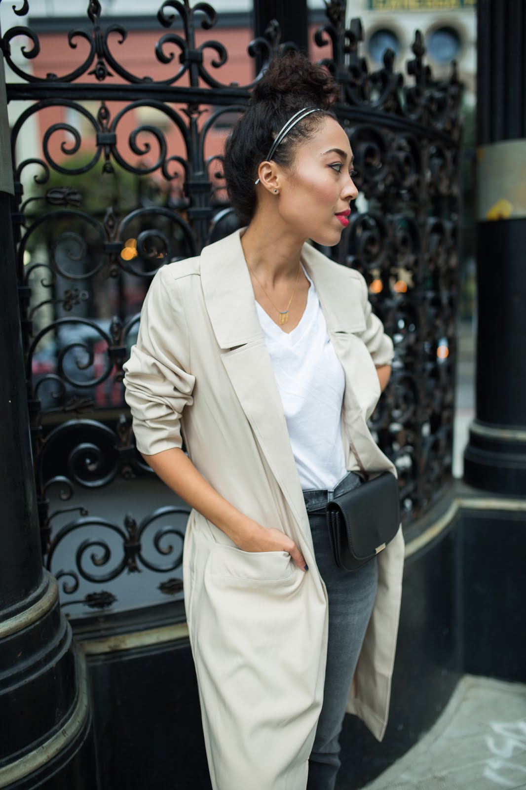 pancake stacker wearing a Two Feathers trench coat, River Island straight leg jeans; Everlane black oxfords, a white tee, and a Zara fanny.