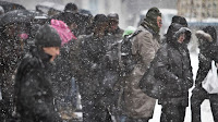 Pedestrians gather at a bus stop during snowfall along Lexington Avenue, in New York. (Image Credit: bebeto matthews/ap/rex/shutterstock) Click to Enlarge.