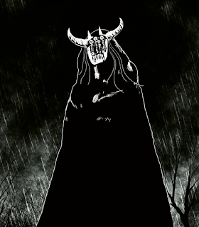 Entirely in black and white, a low angle shot of a robed figure with a monstrous visage. Two ox like horns spring from its temples, with two smaller ones next to each. It has stranged ridged rods covering much of the face, with small discs with runes scrawled on them. A row of dagger like teeth sprouts below it. Its unclear if it is a mask or not. Strands of hair spill from the hood. Rain lashes down around them, wwith a dead trees sprouting from both corners.