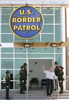 President George W. Bush waves from the new Yuma Sector Headquarters building Monday, April 9, 2007, during his visit to the Arizona border community to speak on immigration reform. The President told his audience, 'We need to work together to come up with a practical solution to this problem, and I know people in Congress are working hard on this issue.' White House photo by Eric Draper.