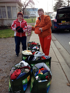 image Omemee Baptist Church - Two Women Preparing to Hand Out Knit Gifts