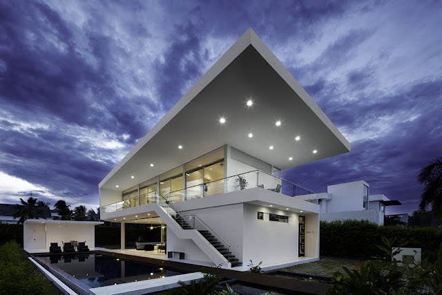Modern home with lights at dusk 