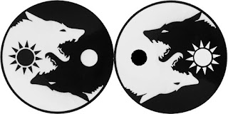 yin and yang held in balance by LOVE at Source. image created with two wolf heads; moon and sun