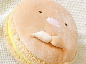 A photo showing a Summikko Gurashi character macaron cushion