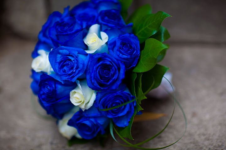 A closeup of the blue rose bridal bouquet The bridesmaids bouquets are made