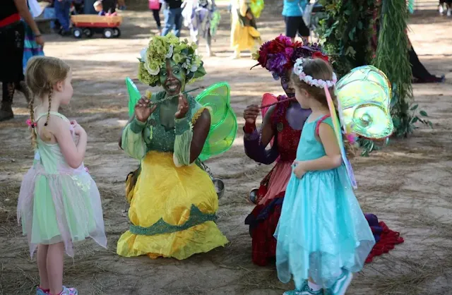 two Black women dressed as fairies in Texas Renaissance Festival