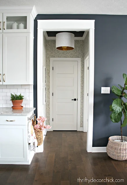 Small hallway with blue and white wallpaper