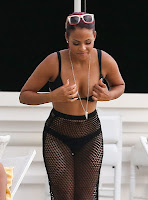 Christina Milian fixing her black bikini top