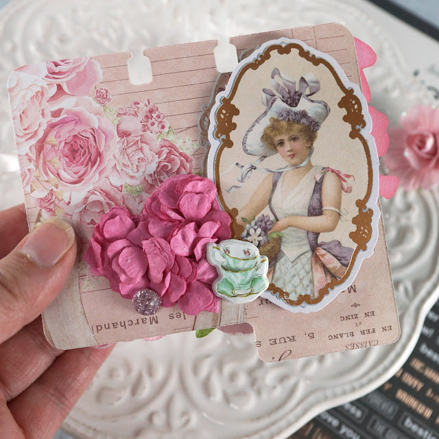 Heidi Swapp Memorydex Valentine's advent calendar made with the Prima With Love collection by Frank Garcia; handmade DIY die cut chocolate box; decorated with ephemera, stickers, paper flowers; paper bow and crinkle ribbon