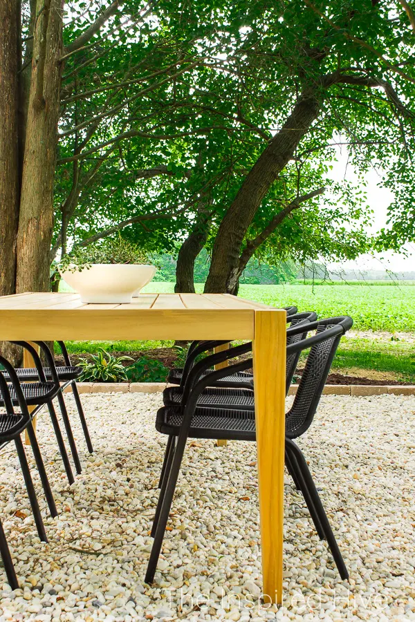 Gravel patio with teak dining table