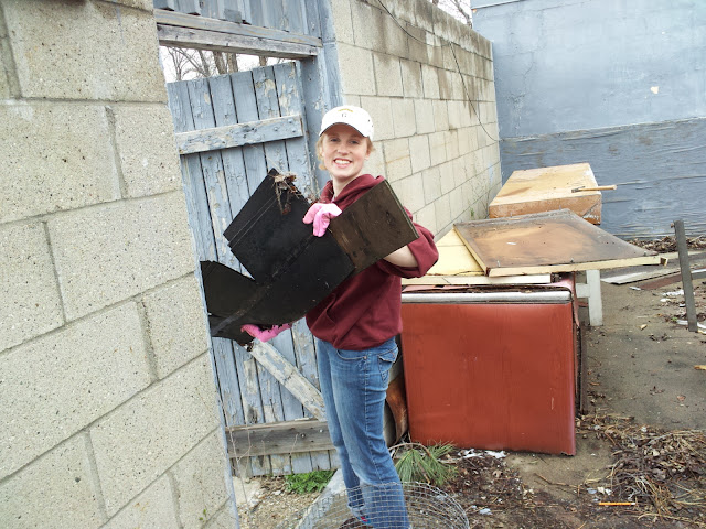 claire hauling rain-soaked wood